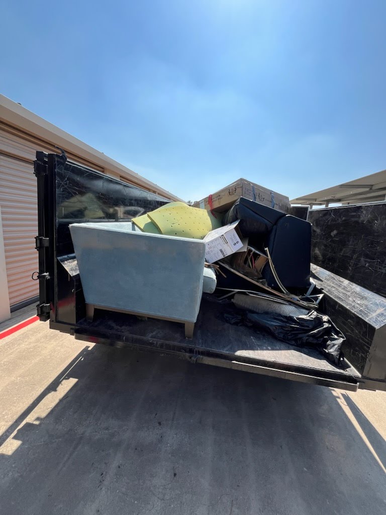 Clearout Junk crew removing a sofa from a Spring, TX home
